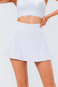 High waist pleated active skirt in white, featuring a stretchy material perfect for workouts.