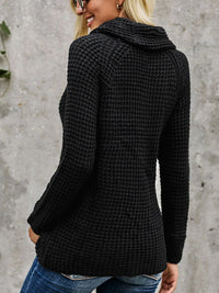 Black full size textured turtleneck long sleeve sweater with decorative buttons, showcasing back view on a model.
