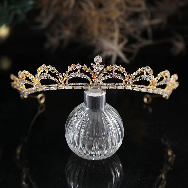 a tiara on a glass vase on a table