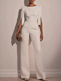 Wide-Leg Jumpsuit with Slit Sleeve worn by a stylish model, showcasing elegant design and fitted silhouette.