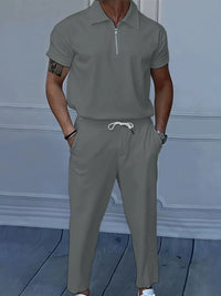Men's gray quarter zip short sleeve polo and pants set, featuring drawstring and pockets, perfect for casual or formal wear in NZ.