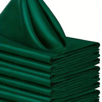 a stack of green napkins sitting on top of each other