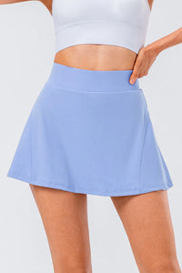High waist pleated active skirt in light blue, showcasing a stretchy and comfortable fit for active wear.
