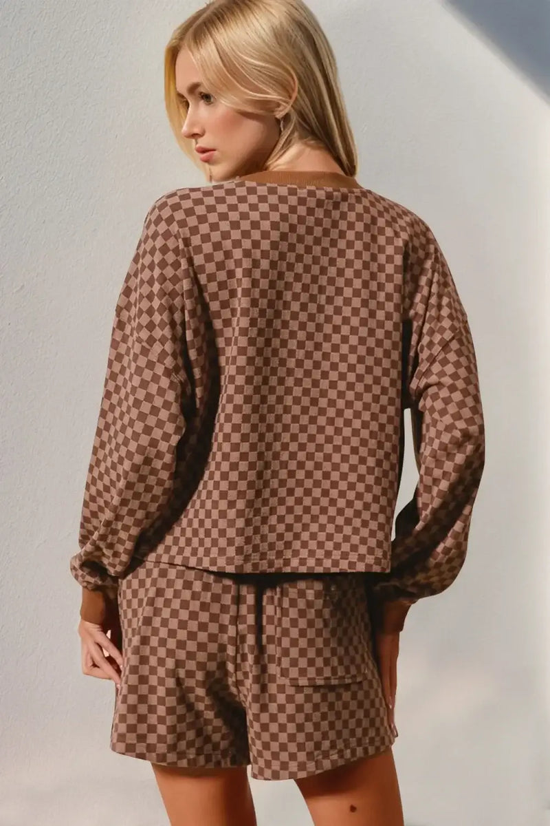 Back view of Double Take Checkered Half Button Top and Shorts Set in brown checkered pattern, showcasing a relaxed fit.