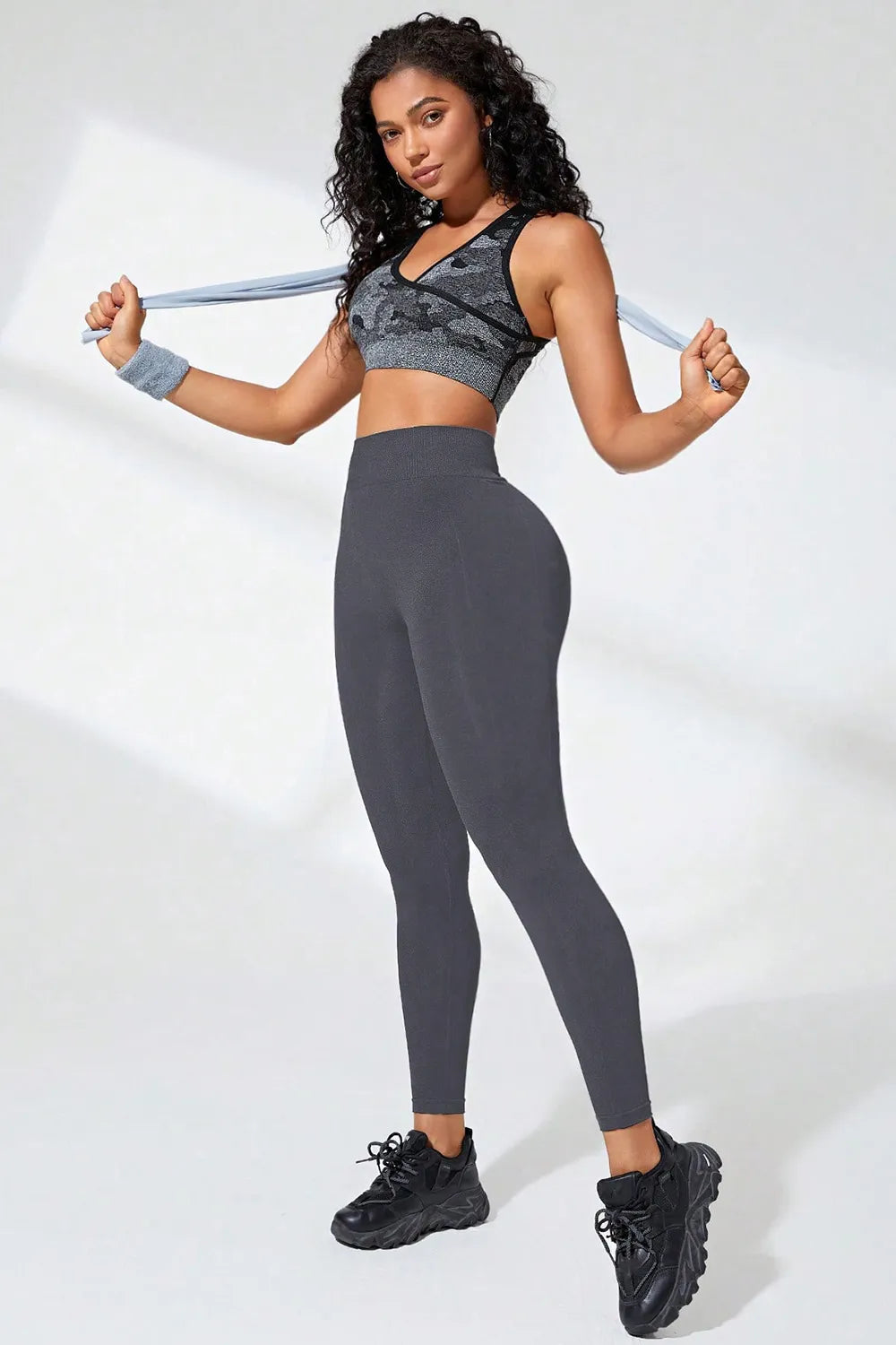 High waist active leggings in grey, model wearing athletic outfit with a sport bra, suitable for workouts and casual wear.