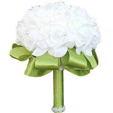 a bouquet of white flowers with a green ribbon