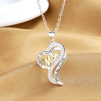 a mom necklace with a heart shaped pendant