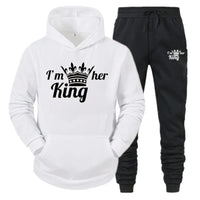 a white hoodie and black sweatpants with the words i'm her king