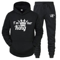 a black hoodie and sweatpants with the words i'm her king printed