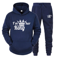 a blue hoodie and sweatpants with a crown on it
