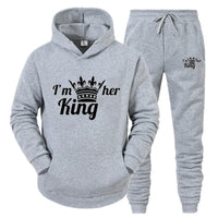 a grey hoodie and sweatpants with the words i'm her king on