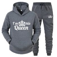 a women's sweat suit with a crown on it