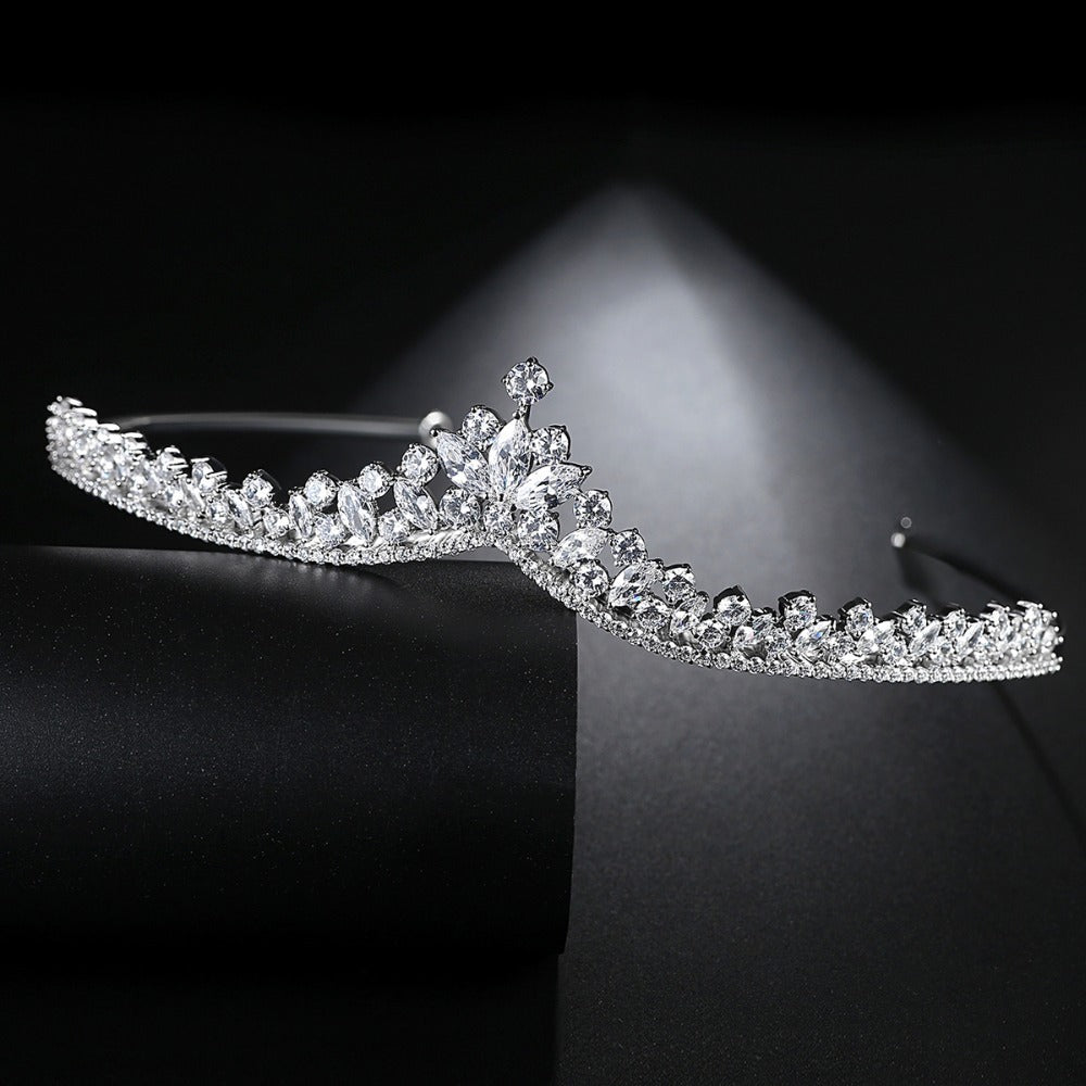 a tiara is shown on a black surface