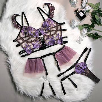 three lingerie bras on a white fur rug