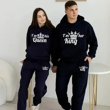 a man and a woman wearing matching sweatshirts