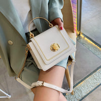 White leather mini crossbody bag with gold accents, perfect for luxurious weddings and stylish outings.