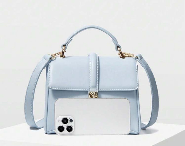 a light blue purse with a camera attached to it