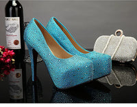 a bottle of wine and a pair of blue high heels