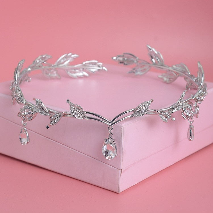 a pink box with a tiara on top of it