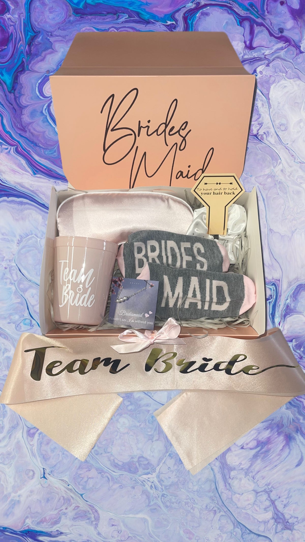 a bride's maid gift box on a marble background