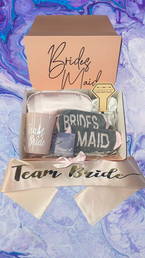a bride's maid gift box on a marble background