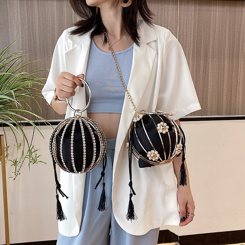 Luxurious black pearl flower handbags with tassels, ideal for elegant weddings and stylish occasions.