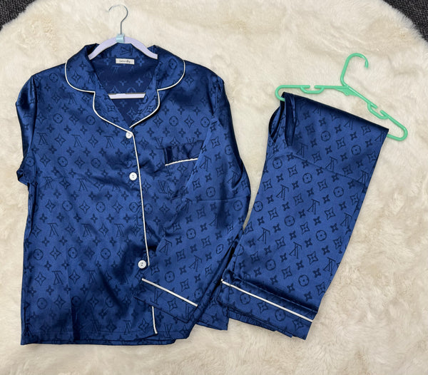 a blue pajama set with monogrammed letters on it