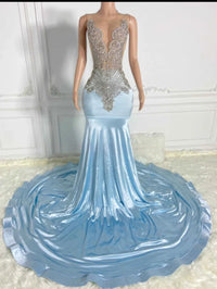 a mannequin is dressed in a blue gown