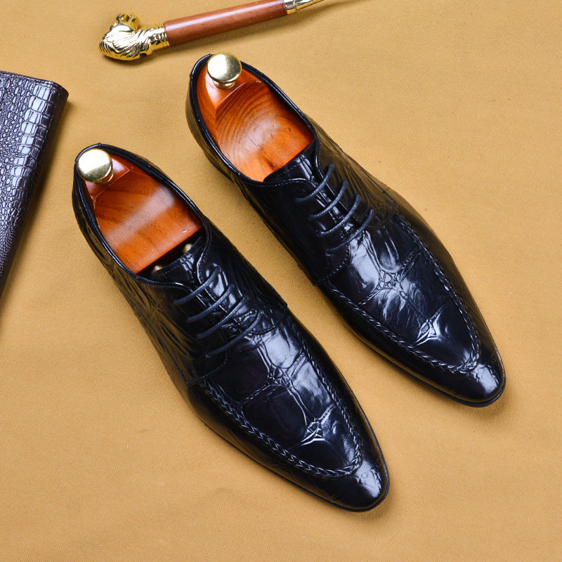 a pair of black shoes sitting on top of a table