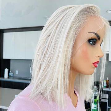a mannequin head with blonde hair and blue eyes