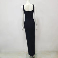 a mannequin wearing a black dress on a white background