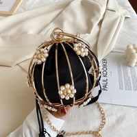 Luxurious pearl and gold flower handbag for elegant weddings and stylish occasions.