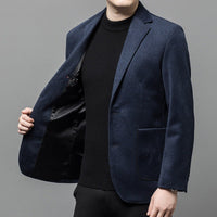 a man in a black shirt and a blue jacket