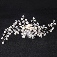 a bridal hair comb with pearls and leaves