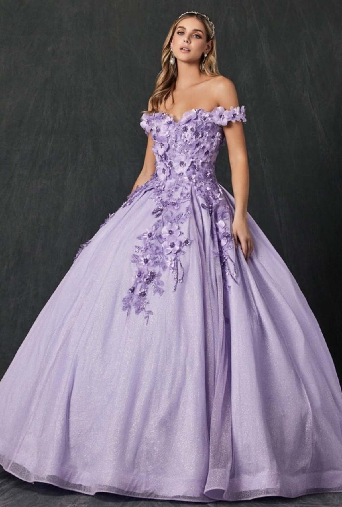 a woman in a purple dress posing for a picture