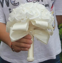 a person holding a bouquet of white flowers