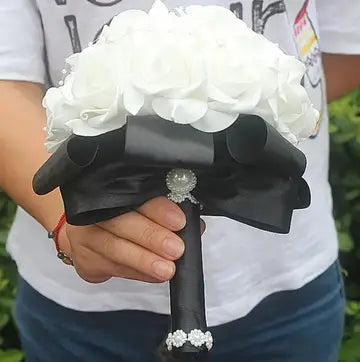 a person holding a bouquet of flowers in their hands