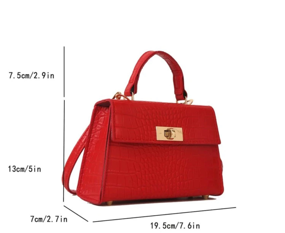 a red handbag with measurements for it