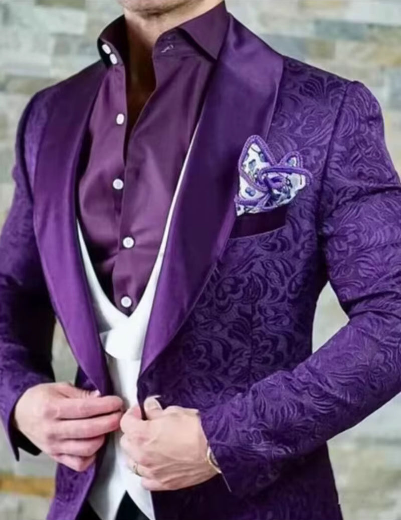 Men's purple jacquard paisley tuxedo with a stylish waistcoat and pocket square, showcasing modern formal fashion.
