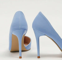 a pair of blue high heeled shoes on a white background