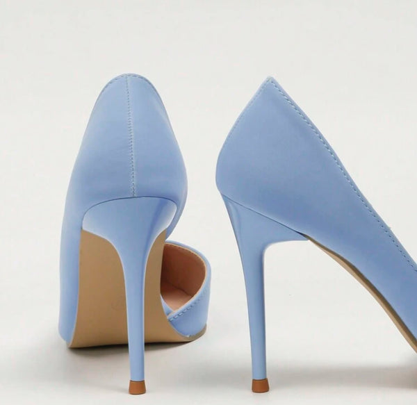 a pair of blue high heeled shoes on a white background