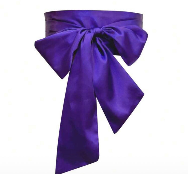Elegant purple bridesmaid waist sash with a large bow, crafted from soft, flowing fabric.