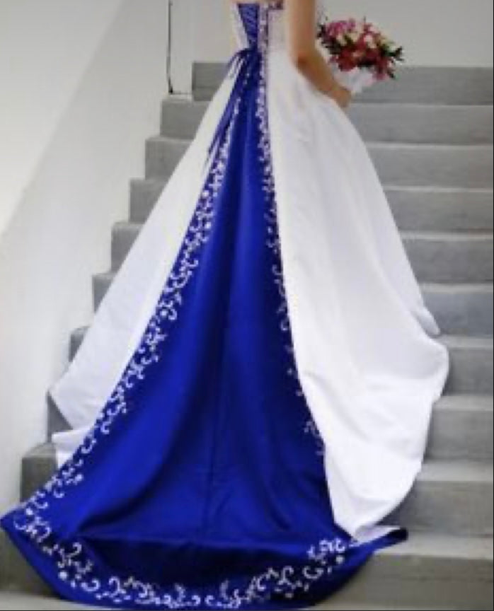 a woman in a blue and white wedding dress