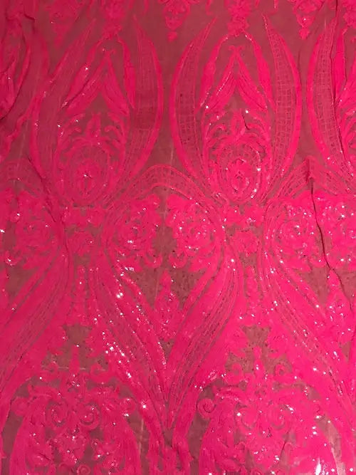 a close up of a pink lace fabric
