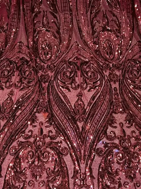 a close up view of a pink sequinized fabric