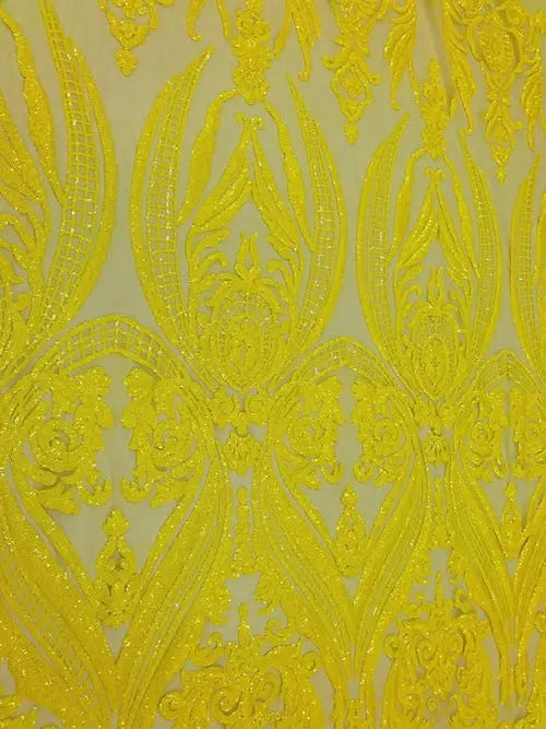 a close up of a yellow lace fabric