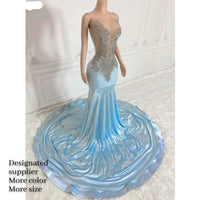 a mannequin is dressed in a blue gown