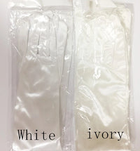 a pair of white gloves that say white ivory