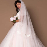 Enchanted Elegance: V-Neck Sleeveless Beaded Ball Gown Wedding Dress Luxurious Weddings