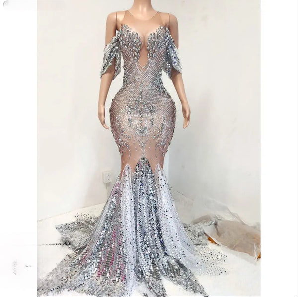 a dress made out of sequins on a mannequin mannequin